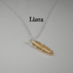 gold feather pendent